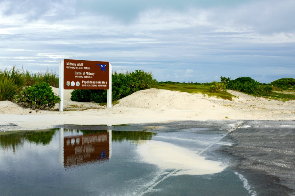 The Midway Atoll National Wildlife Refuge/Battle of Midway National Memorial/Papahānaumokuākea Marine National Monument sign by the cargo pier