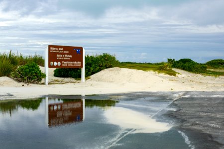 The Midway Atoll National Wildlife Refuge/Battle of Midway National Memorial/Papahānaumokuākea Marine National Monument sign by the cargo pier photo