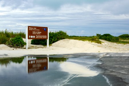 The Midway Atoll National Wildlife Refuge/Battle of Midway National Memorial/Papahānaumokuākea Marine National Monument sign by the cargo pier