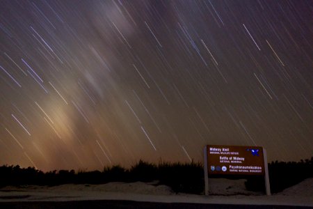 Ultra-long exposure of the Milky Way over the Midway sign by the cargo pier (attempt #2)