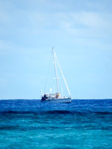 A sailboat attempts to enter the closed waters of Midway Atoll National Wildlife Refuge