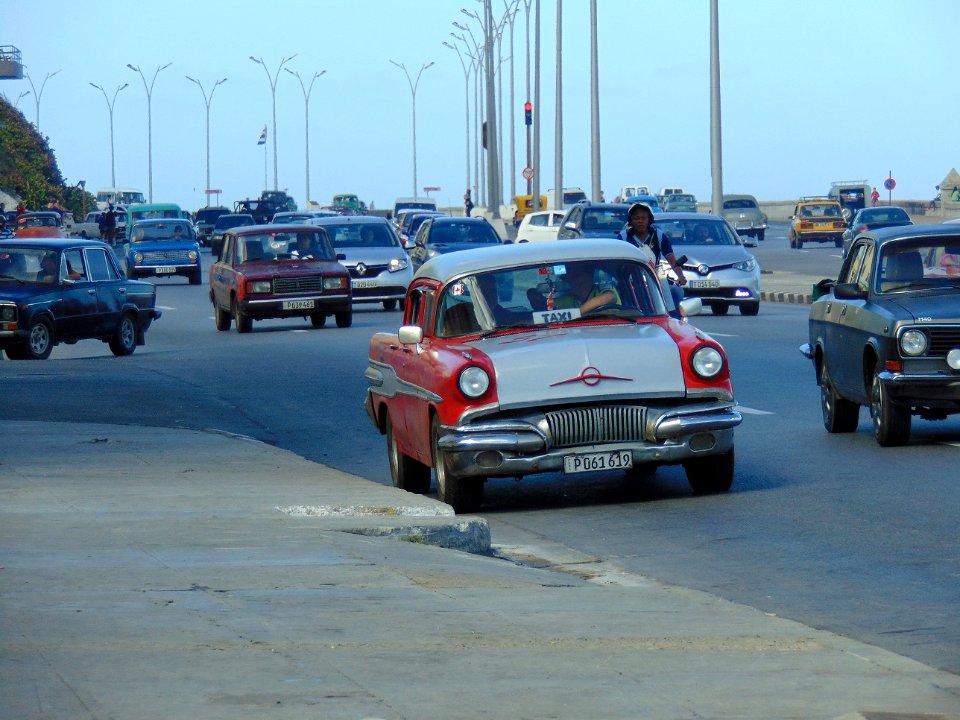Havana. Seafront with red almendrón