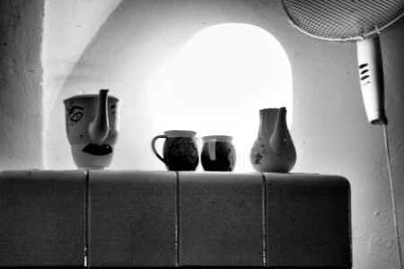 ceramic jugs on the tiled stove photo