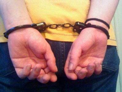 handcuffed guy photo