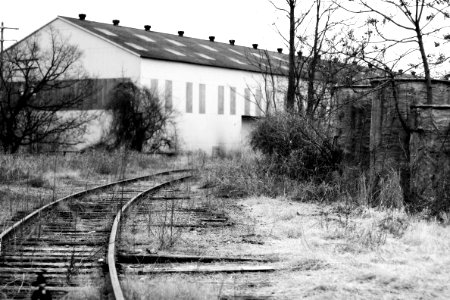 Warehouse by railroad tracks photo