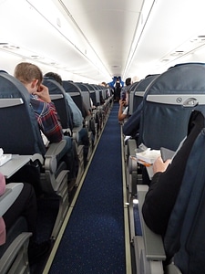 Aircraft attendant rows of seats aircraft interior photo