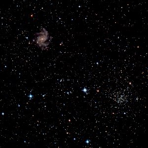 The Fireworks Galaxy and an Open Cluster photo