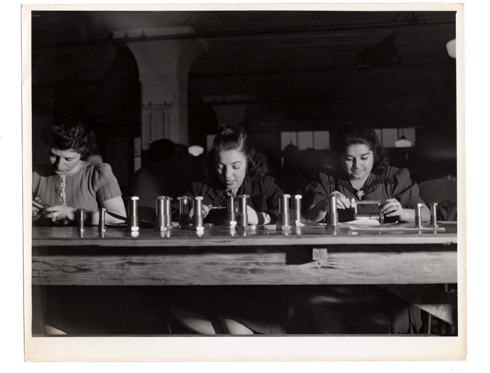 "Girls working on metal lathes"