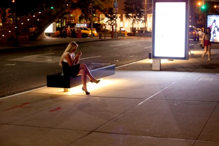 Blonde lighting a cigarette at Lincoln Center