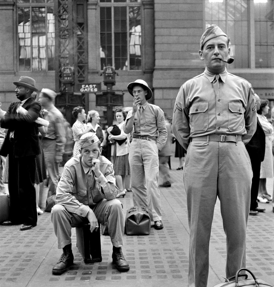 Loners in a Crowd: Waiting for trains at the Pennsylvania railroad station, in New York City, New York, August 1942.