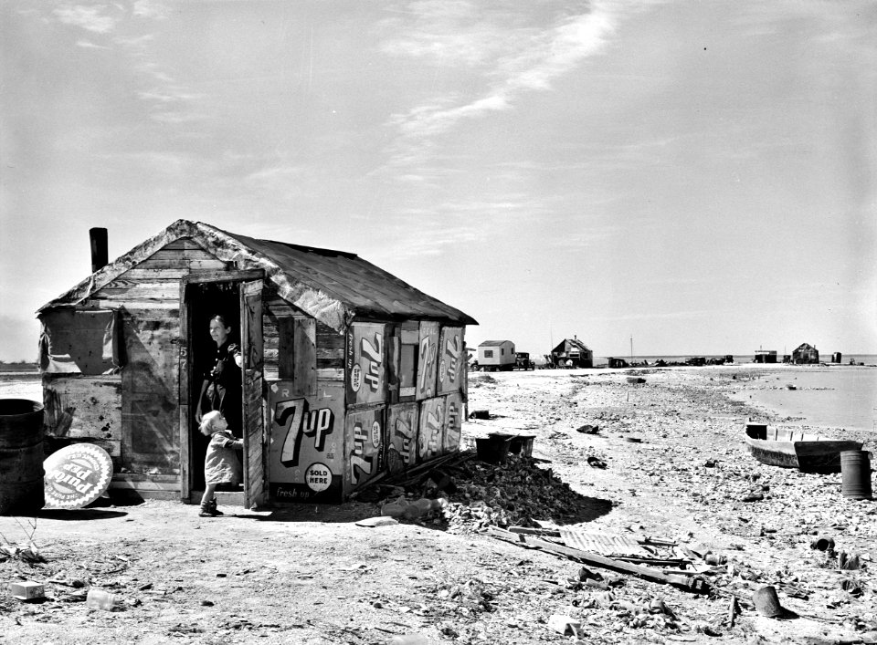 Desperate Times: Shack of war veteran and family with view along Nueces Bay. Corpus Christi, Texas, 1939.