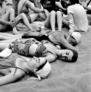 Summer Days: Sun bathers on the sand beach at the swimming pool in the Glen Echo amusement park. Maryland, July 1943.