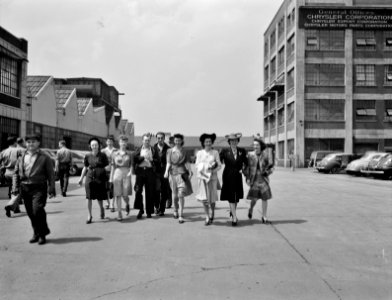 Dayshift Set: Workers coming out of the Highland Park Chrysler plant. Detroit, Michigan. Spring, 1942. photo
