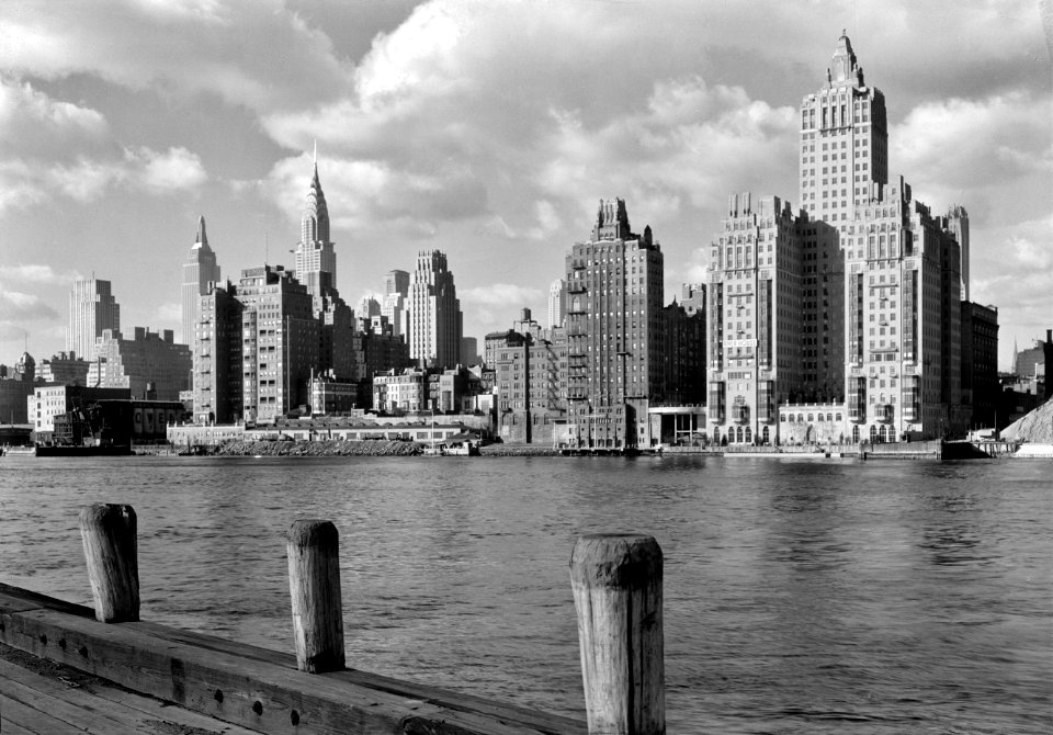 River House, 52nd St. and E. River, New York City. Shore line with clouds. December 1931.