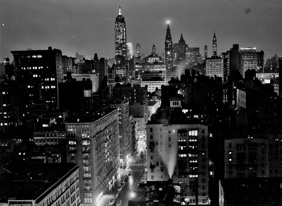 Night and the City: A rainy evening in New York City, looking north from University Place, September 1939.
