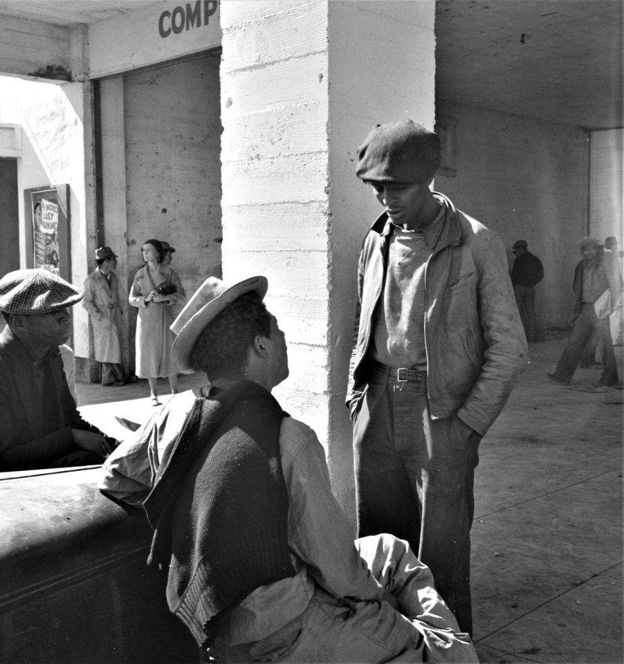 Talking Hard Times: Scene outside the Farm Security Administration grant office during the pea harvest. Calipatria, California, February 1939. During spring 1938 for the first time, the labor surplus had grown so large that relief grants were necessary.
