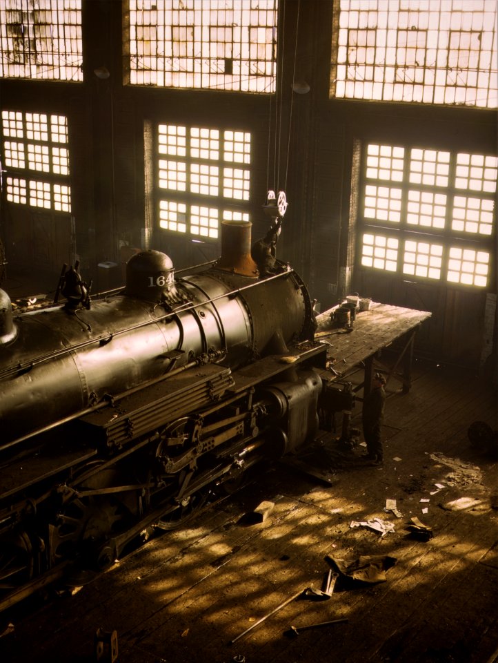 Engine 1646: Chicago and North Western railroad, working on a locomotive at the 40th Street railroad shops. December 1942.