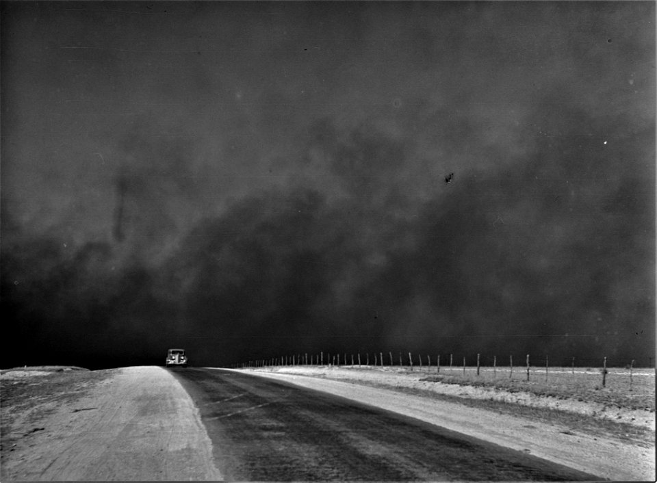 Wrath: Heavy black clouds of dust rising over the Texas Panhandle, Texas, March 1936.