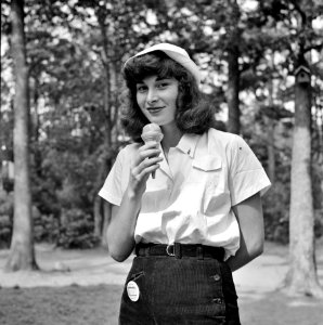 Summer Delight: A student eating an ice cream cone at the National music camp in Interlochen, Michigan where 300 or more young musicians study symphonic music for 8 weeks each summer. August 1942.