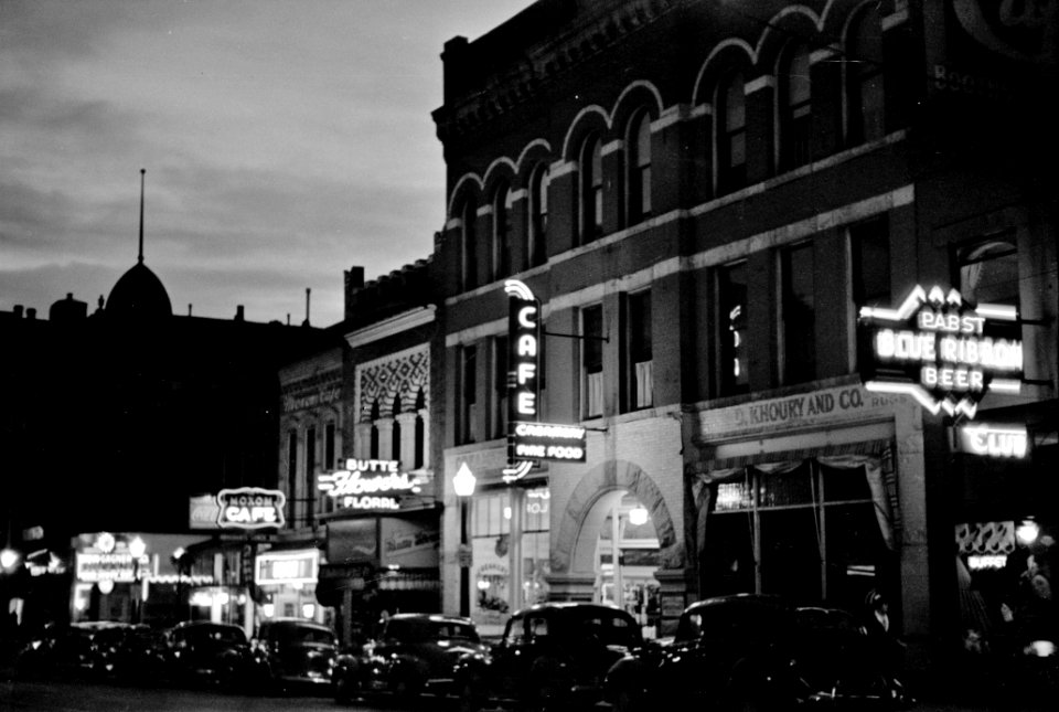 The Lighted Way: Night street scene in Butte, Montana, 1939.
