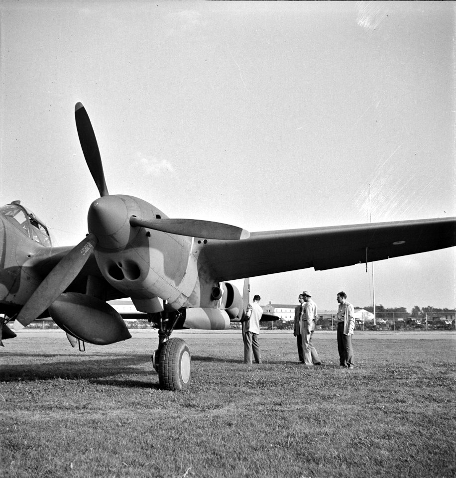 Inspection Arms: A United States Army Air Corps air ferry command base sixteen miles from Detroit, Michigan at Wayne County Airport. Factory inspector and Captain Roddy inspect a new P-38, Sept 1942.
