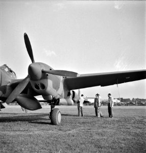 Inspection Arms: A United States Army Air Corps air ferry command base sixteen miles from Detroit, Michigan at Wayne County Airport. Factory inspector and Captain Roddy inspect a new P-38, Sept 1942.