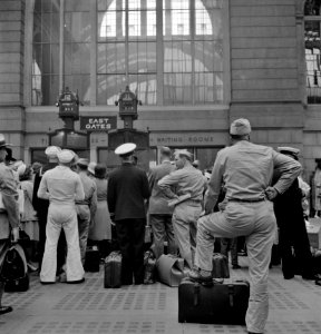 Hurry Up and Wait: Servicemen waiting for trains at Pennsylvania railroad station, New York, New York. August 1942. photo