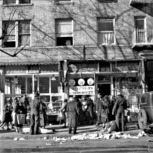 Sidewalk Bizarre: Scene along Bathgate Avenue in the Bronx, New York, December 1936. photo