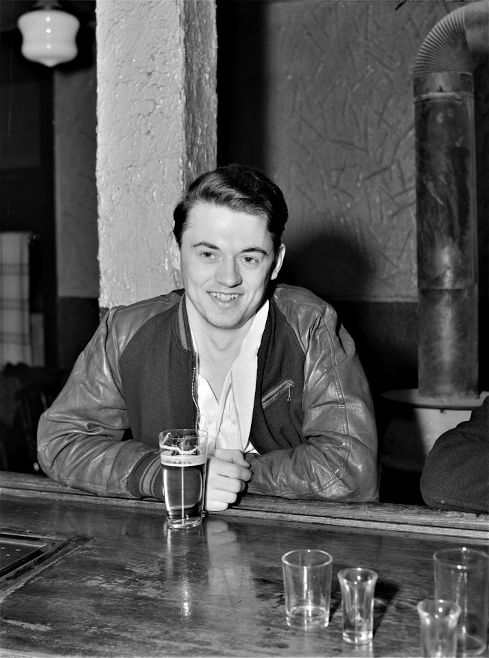 Growing Boy: A young steelworker at a bar in Ambridge, Pennsylvania. January 1941.