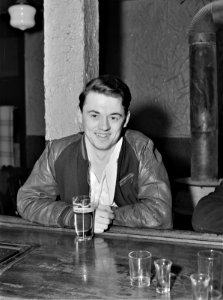 Growing Boy: A young steelworker at a bar in Ambridge, Pennsylvania. January 1941. photo