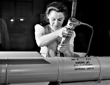 I Put Away Childish Things: From toy trains to parachute flare casings, Stephanie Cewe has turned to the aid of Uncle Sam. She used to assemble toy locomotives; today, she uses the same screwdriver to assemble flare casings. New Haven, Connecticut, Feb 19