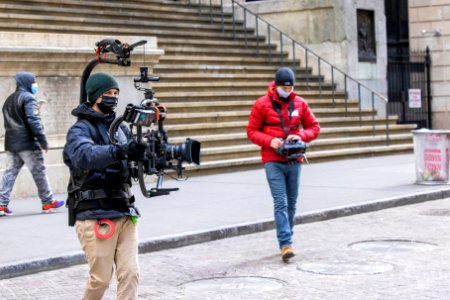 Another film crew with an open scene in front of Federal Hall