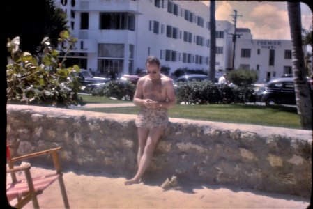 1940s kodachrome slide of a man in front of the Colony Hotel in Miami Beach, Florida. "42" written in pencil on back. photo