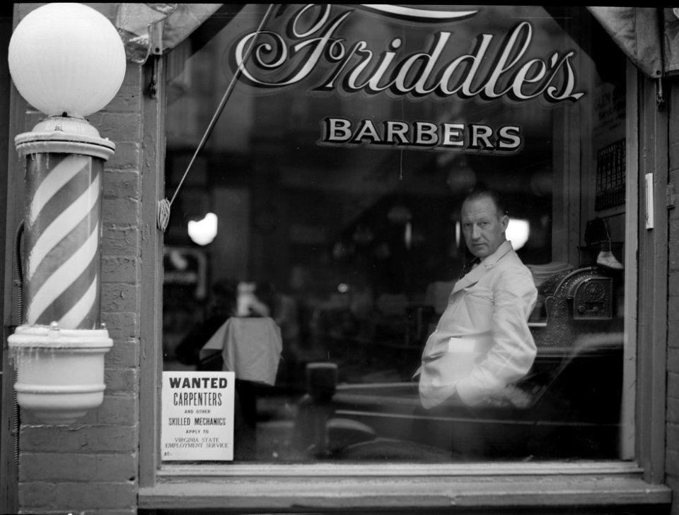 Poster in the window of a business in Harrisonburg, Virginia for the State Employment Service aiding in the tapping of the skilled labor resources of the Shenandoah Valley, 1941.