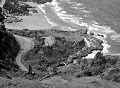 Of a Fallen Angel: The Devil's Cauldron and the Oregon coast highway, features of the Resettlement Administration's recreation area which attract many tourists. Oregon, June 1936.