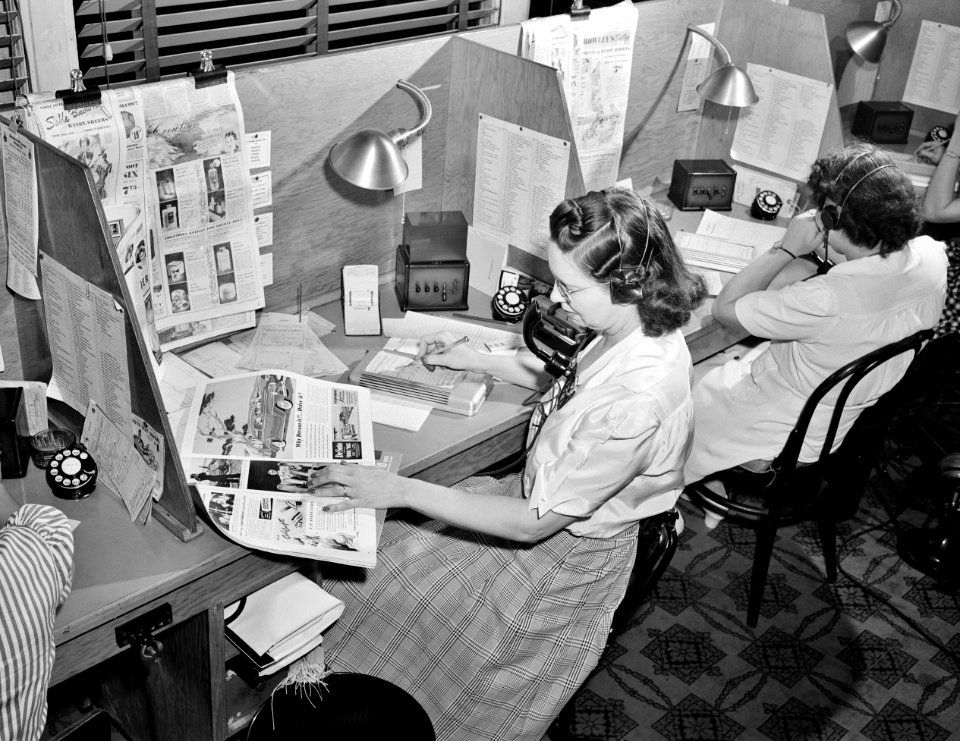 Operator taking telephone orders at the Crowley-Milner department store. Detroit, Michigan, July 1941.