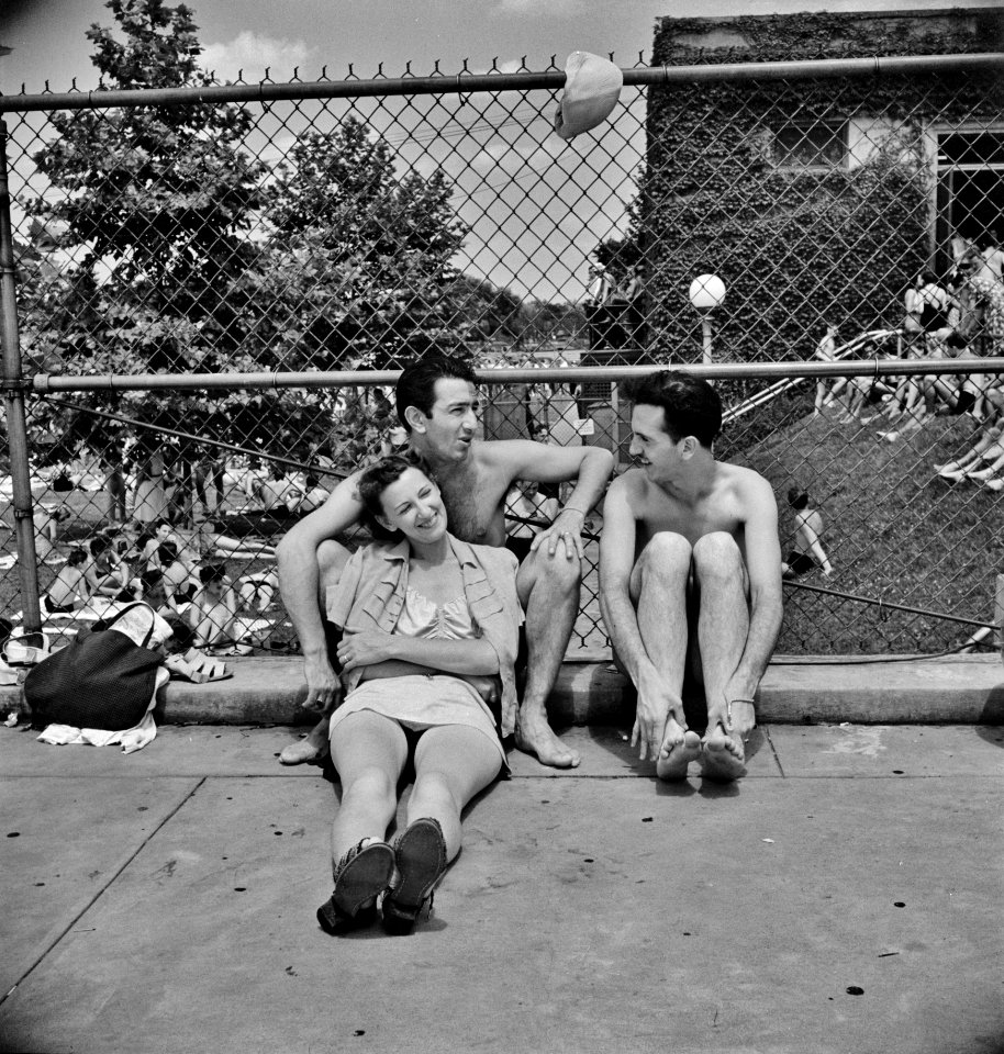 Three's Company: Relaxing on the edge of the municipal swimming pool on Sunday. Washington, D.C. July 1942.