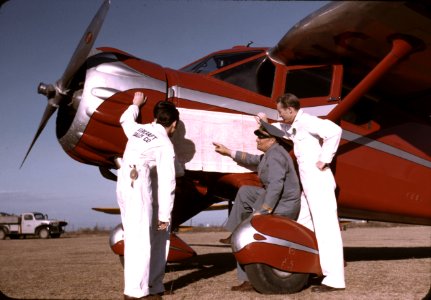 You Are Here: Instructor and students studying a map, Meacham Field, Fort Worth, Texas. January 1942