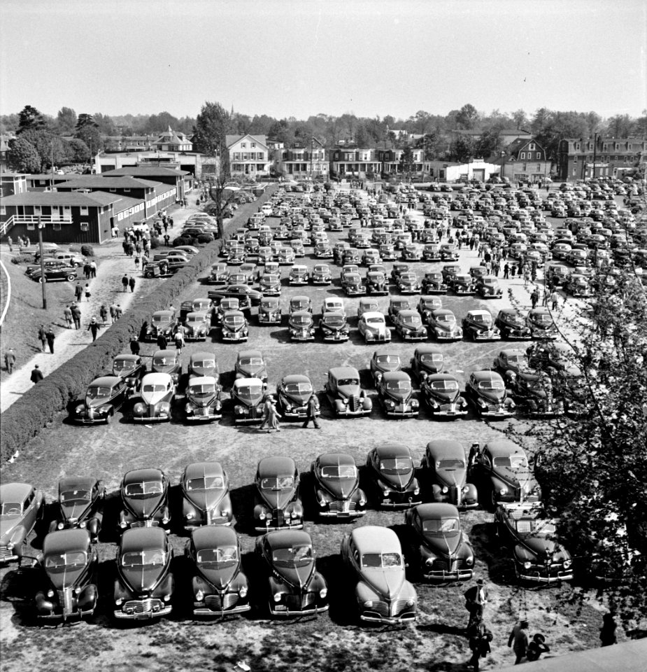 In Peace and War: Cars parked, despite gas rationing, at the Pimlico racetrack. Baltimore, Maryland, May 1943.