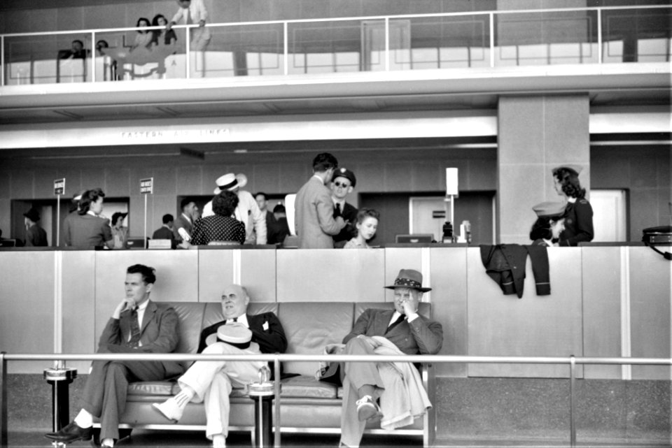 Three's a Crowd: Passengers in the waiting room at the municipal airport in Washington, D.C. July 1941