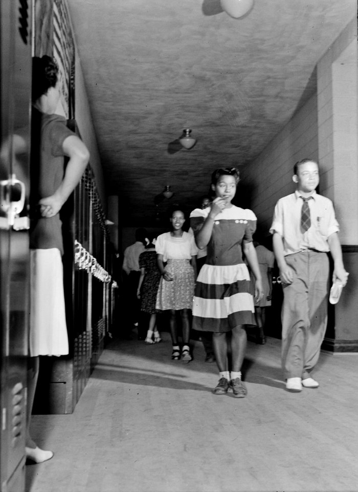 Hall Monitor: The corridor between classes at Central High School. A teacher watching to see that the students keep in order. Charlotte Court House, Virginia, June 1943