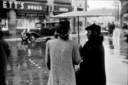Shelter for Two: Main street intersection in Norwich, Connecticut on a rainy day. November 1940