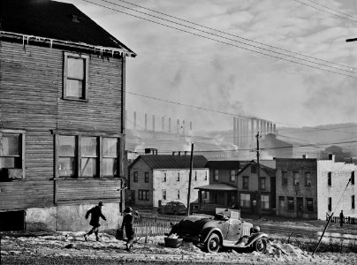 The Crucible: Houses of the mill town overlooking the Pittsburgh Crucible Steel Company in Midland, Pennsylvania, January 1941.