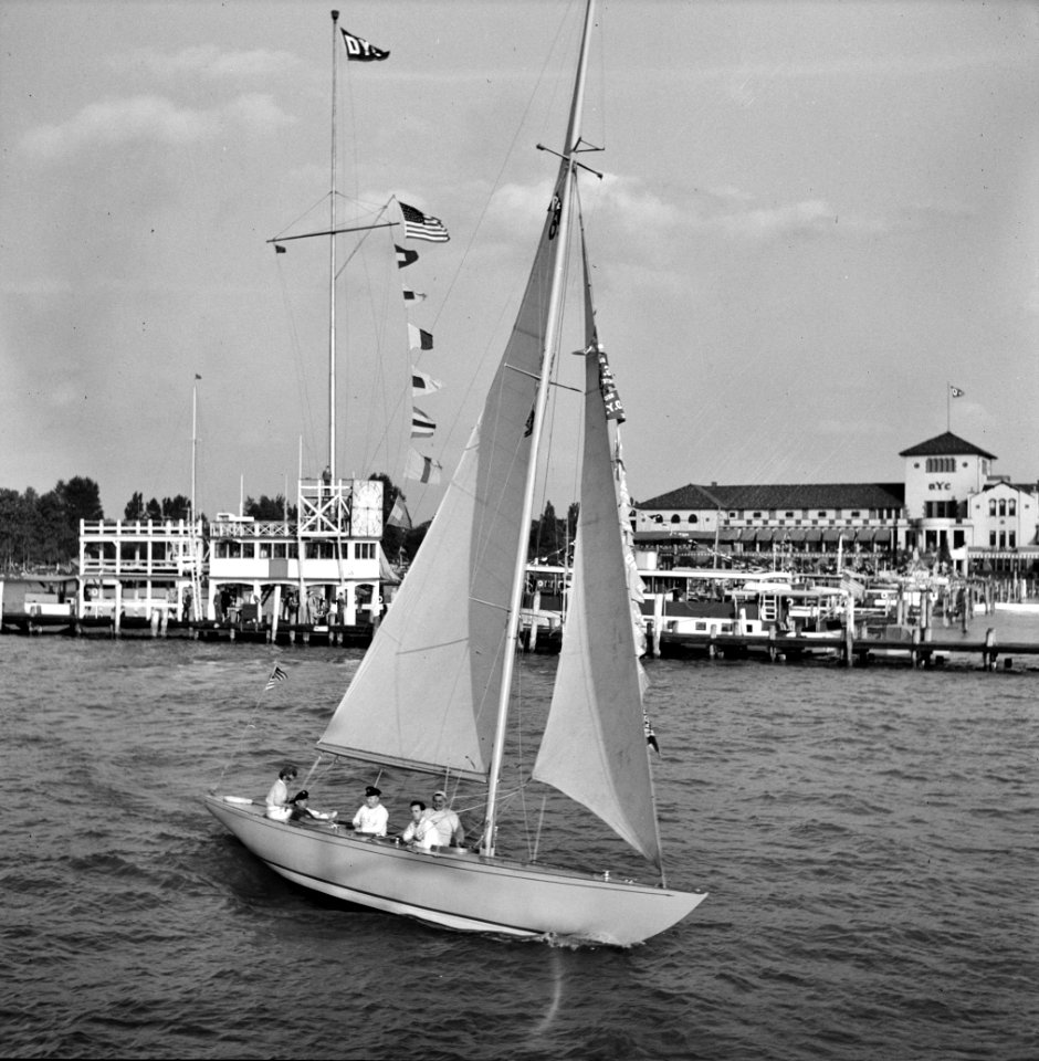 Into the Wind: Sailing boat at a Venetian night party at the Detroit yacht club, whose members represent the wealthier class of manufacturers and their friends, 1940.