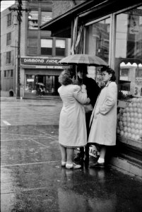 Rainy Day Confidential: Waiting for a bus in Norwich, Connecticut. November 1940.