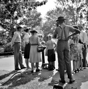 Share Alike: Group waiting to drink water out of a public fountain in the zoological park. Detroit, Michigan. July 1942