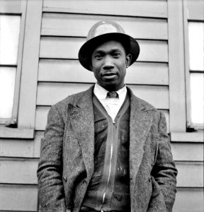 American Worker: A Black shipyard worker who helps build Liberty Ships at the Bethlehem-Fairfield shipyards, Baltimore, Maryland. May 1943. photo