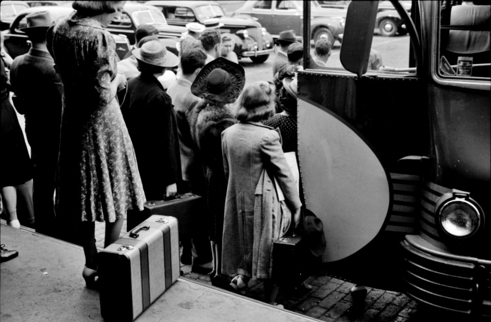 Boarding: Bus passengers at the Greyhound bus station in Harrisburg, Pennsylvania. 1940.