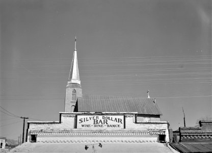 Heaven & Earth: View of a Saloon and a church in Austin, Nevada, March 1940.
