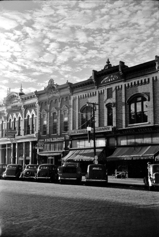 Touch the Sky: Stores on main street in Grundy Center, Iowa October 1939.